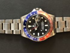 GENTLEMEN'S VINTAGE ROLEX OYSTER PERPETUAL GMT WRISTWATCH REFERENCE 1675, circular black dial,