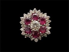 Ruby and diamond ring, central round brilliant cut diamond weighing an estimated 0.45ct,