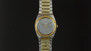 LADIES' OMEGA SEAMASTER WRISTWATCH, circular blue dial with gold hour markers and a date aperture,