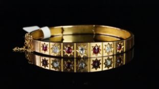 Antique ruby and diamond clasp bangle, alternating old mixed cut diamonds and cushion cut rubies,