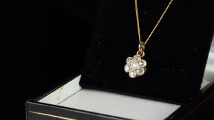 Diamond cluster pendant, seven stone, old cut diamond daisy cluster, set in yellow metal tested as