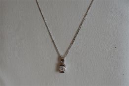 Single stone diamond pendant, round brilliant cut diamond weighing an estimated 0.10ct, set in 9ct