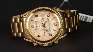 MICHAEL KORS CHRONOGRAPH WRISTWATCH, circular salmon triple register dial, diamente bezel on a