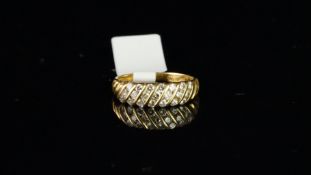 Diamond band ring, set with seven diagonal columns of three round brilliant cut diamonds, each
