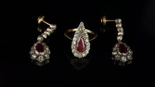 A pair of ruby and diamond drop earrings, pear cut ruby surrounded by old cut diamonds, suspended