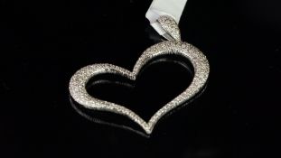 Diamond heart pendant, designed as an abstract open heart, pave set with round brilliant cut