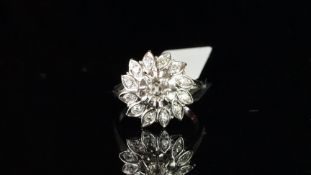 Diamond cluster ring, central old cut diamond weighing an estimated 0.40ct, surrounded by twelve