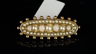 Pearl mourning brooch, oblong plaque set with seven graduated pearls, surrounded by seed pearls,