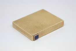 Vintage Cartier compact, rectangular ribbed case with concealed hinge, six calibre cut sapphires