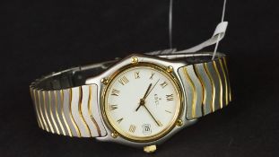 LADIES' EBEL BI METAL WRISTWATCH, circular off white dial with gold Roman numerals and a date