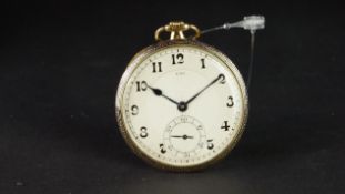 UTI 18K GOLD POCKET WATCH, circular silver two tone dial with Arabic numerals, outer minute track,