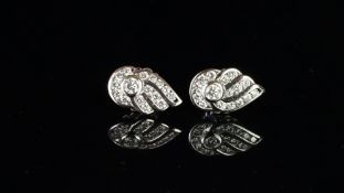 A pair of diamond cluster earrings, round brilliant cut diamonds in a 'wing' design, mounted in