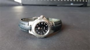 LADIES' TAG HEUER KIRIUM WRISTWATCH REF. WL1312-0, circular black dial with dot hour markers and a