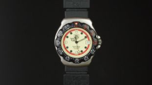 MID SIZE TAG HEUER PROFESSIONAL WRISTWATCH REF. 371.513, circular luminous green dial with dot