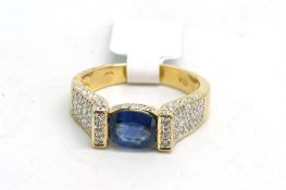 Sapphire and diamond ring, with an oval sapphire, set horizontally, with round brilliant cut