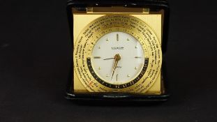 LUXOR GMT DESK CLOCK, circular silver dial with gold hour markers, gmt bezel, 76mm case in leather