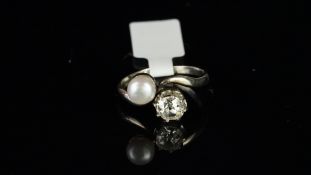 Pearl and diamond crossover ring, old cut diamond weighing an estimated 0.80ct, and a 6mm white