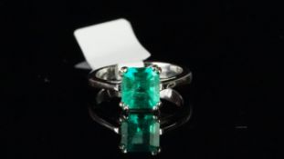 Single stone emerald ring, square step cut emerald measuring 7.35 x 7.12 x 4.76mm, mounted in
