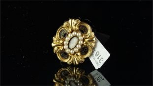 Historical interest: Pearl and enamel memorial brooch, central locket compartment containing a