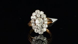 Diamond cluster ring, central old cut diamond weighing an estimated 0.70ct, with three old cut