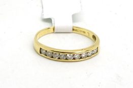 Diamond half eternity ring, nine round brilliant cut diamonds weighing an estimated total of 0.25ct,