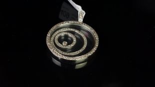 Floating diamond necklace, two diamond set open circles, with a central collet set round brilliant