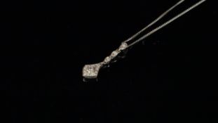 Diamond cluster pendant, set in white metal stamped 9ct, on a white metal chain stamped 18ct