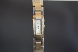 LADIES' GUCCI 4600L DIAMOND SET WRISTWATCH, rectangular mother of pearl dial with silver hands,