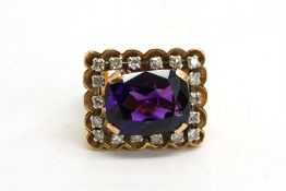 Amethyst and diamond ring, emerald cut amethyst, claw set, surrounded by single cut diamonds, with a