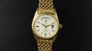 VERY RARE ROLEX DAY DATE 18K GOLD WRISTWATCH REF. 6611, circular off white dial with gold hands