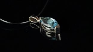 A blue topaz pendant, marquise shaped, chequerboard cut blue topaz, set in 9ct white gold