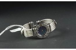 LADIES' CHARIOL BANGLE WRISTWATCH, circular mop dial with dot hour markers, Roman numerals on bezel,