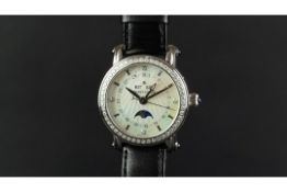 MID SIZE MAURICE LACROIX TRIPLE CALENDAR WRISTWATCH, circular mop dial with dot hour markers,
