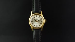 LADIES' OMEGA GENEVE WRISTWATCH, silver dial with faceted hour markers and black hands, 22mm gold