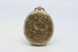 Edwardian locket, oval, engraved floral design, with hair locket inside, measures 40 x 30mm