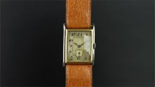 GENTLEMEN'S 1930/40s BI COLOUR WRISTWATCH, rectangular aged dial with Arabic numerals, gun metal