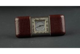 TIFFANY & CO TRAVEL CLOCK WITH T & CO SOFT POUCH, square silver dial with black hands, Roman