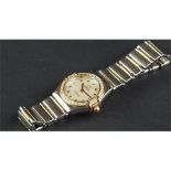 LADIES' OMEGA CONSTELLATION, circular white dial, with gold bevelled hour markers, diamond bezel, on