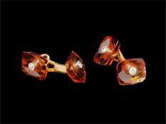 Amber and diamond cufflinks, rectangular cut amber with a central collet set old cut diamond,