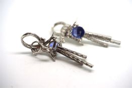 Sapphire and diamond earrings, each earring is set with an oval cut blue sapphire weighing an