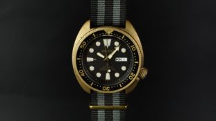 UNUSUAL CUSTOM SEIKO TURTLE  DIVERS WATCH, black circular dial, luminous hour markers, day/date