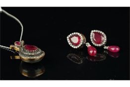 Ruby and paste pendant, set with a central pear cut ruby with a double surround of paste stones, set