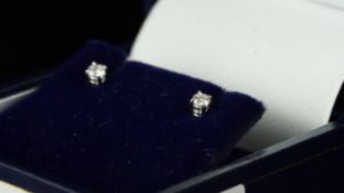 Diamond ear studs, round brilliant cut diamonds, weighing an estimated total of 0.10ct, set in