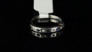 Sapphire and diamond half eternity ring, set in white metal with partial marks, ring size M
