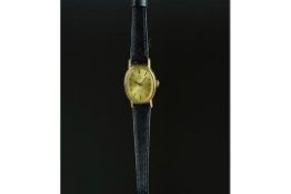 LADIES' OMEGA DE VILLE WRISTWATCH, oval gold dial with baton hour markers and black hands, 18mm g/