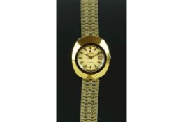 LADIES' RADO DIASTAR WRISTWATCH, circular gold dial, baton hour markers and a date aperture, 26mm