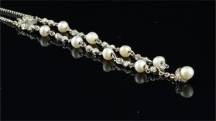 Pearl and diamond bracelet, designed as alternating links of rose cut diamond set bows and single