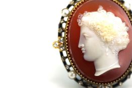 Cameo brooch, oval carnelian base, surrounded by rose cut diamonds, pearls and black enamel, mounted