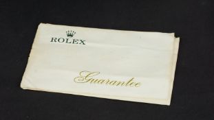 VINTAGE ROLEX GUARANTEE PAPERWORK, 10x7cm 7 page booklet, unsigned with watch number, marked 1972