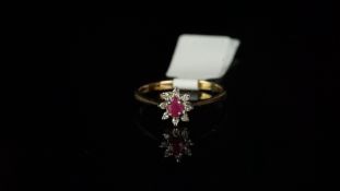 Ruby and diamond oval cluster ring, mounted in hallmarked 9ct yellow gold, central oval ruby,